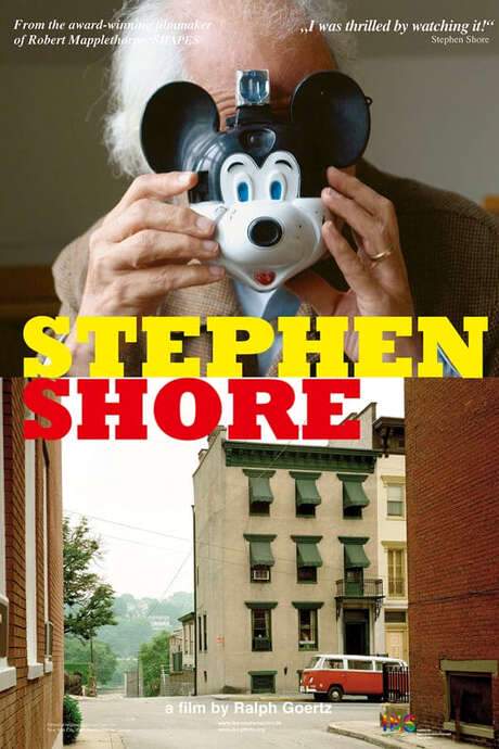 Documentary follows Stephen Shore, an American photographer who helped define the New Color Photography movement of the 1960s‑70s. It opens with his school‑era Warhol portraits, tracks his shift from black‑and‑white to color using a Mick‑a‑Matic and 35 mm camera, and ends with his ‘American Surfaces’ series and ‘Uncommon Places’ work on 8×10 film.